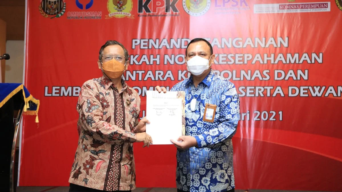 Logo KPK di Spanduk MoU Firli-Mahfud MD Salah?